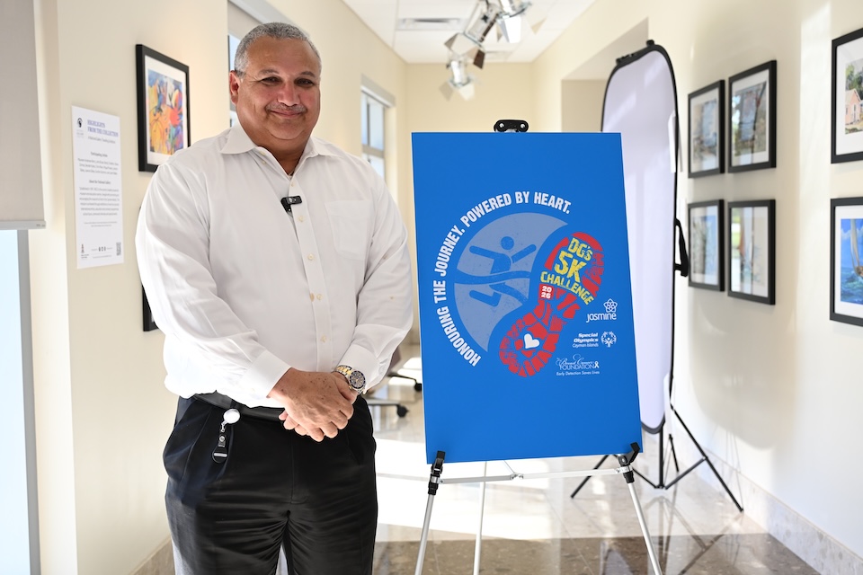 Deputy Governor Honourable Franz Manderson and the logo for the 5K Challenge.